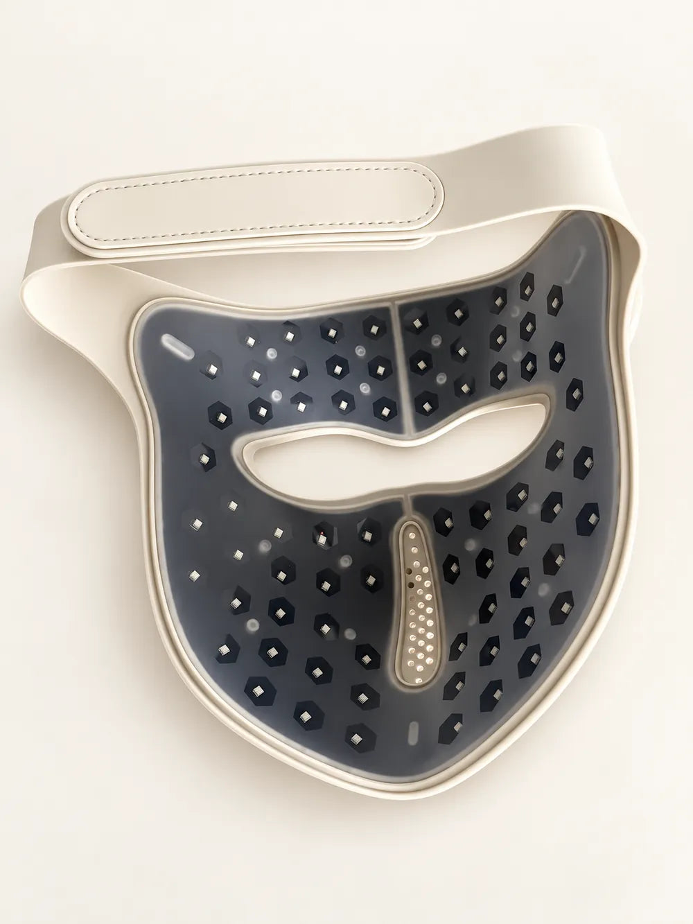 Inside view of the Luxe Mask showing the light array, eye opening and strap on an ivory studio background